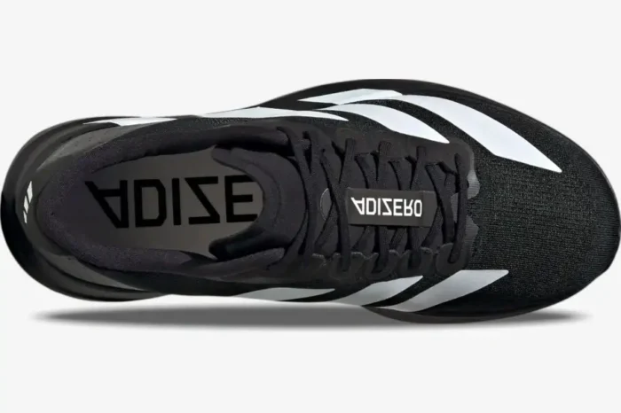 Top-down view of Adidas Adizero Evo SL running shoes in core black and cloud white with white stripes. - SKU JP7149