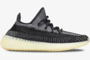 Side profile of Adidas Yeezy 350 V2 Carbon sneakers featuring black and grey knit with a cream sole. - SKU FZ5000
