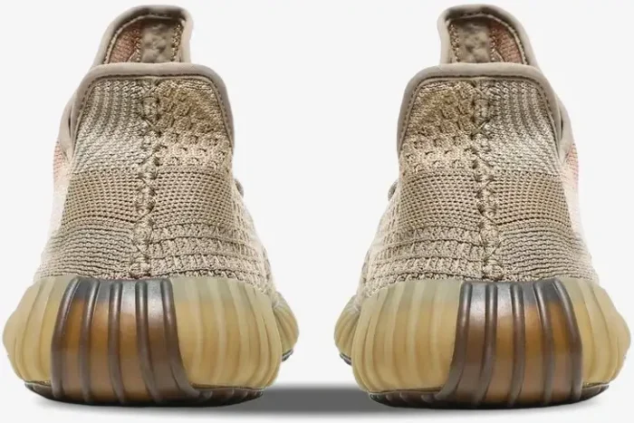 Rear view of Adidas Yeezy 350 V2 Sand Taupe sneakers showing the tan knit upper and ribbed brown translucent sole. - SKU FZ5240