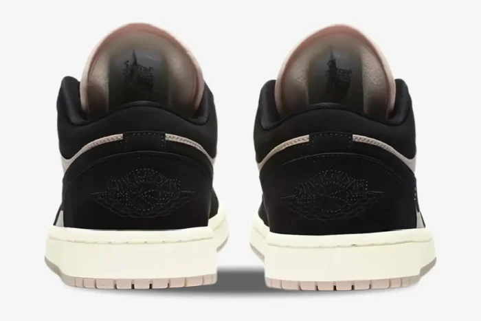 Rear view of women's Air Jordan 1 Low Black Guava Ice sneakers with black suede heels and embroidered wings logo. - SKU DC0774-003