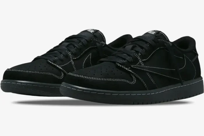 Air Jordan 1 Low OG x Travis Scott Black Phantom sneakers in a three-quarter front view with white stitching. - SKU DM7866-001