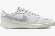 Side view of Air Jordan 1 Low x Union LA sneakers in white and neutral grey with canvas upper. - SKU DO8912-101