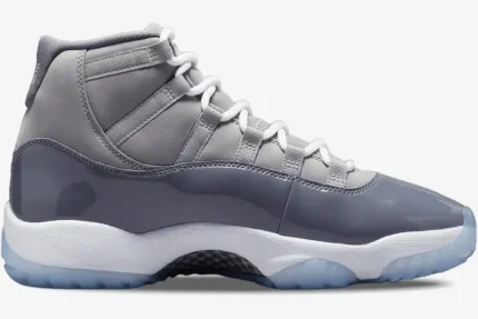 Side profile view of the Air Jordan 11 Retro Cool Grey sneaker with grey patent leather and white midsole. - SKU CT8012-005