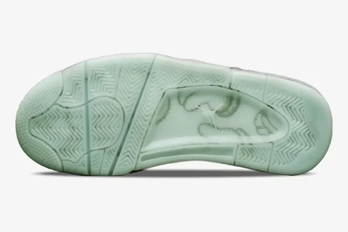 Bottom view of Air Jordan 4 Retro x Kaws Cool Grey featuring a translucent glow-in-the-dark sole. - SKU 930155-003