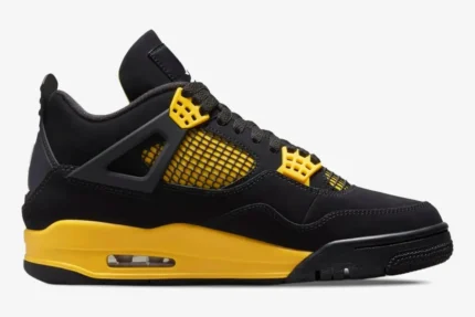Air Jordan 4 Retro Thunder sneaker in black and tour yellow, side profile view. - SKU DH6927-017