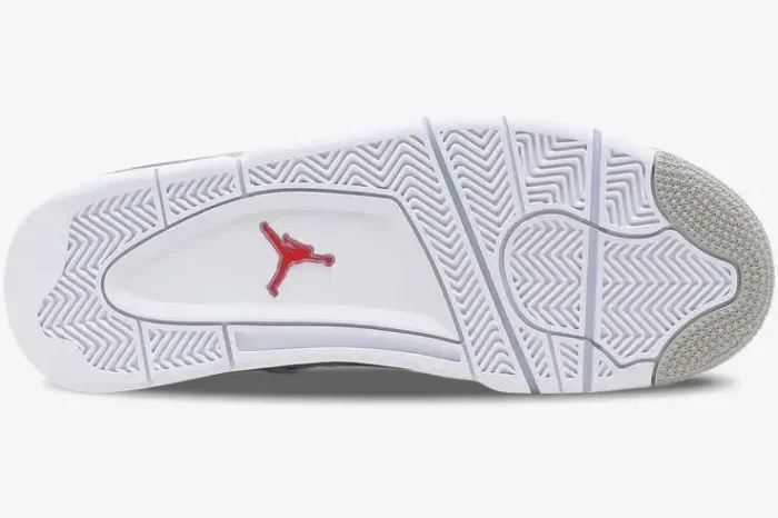 Bottom view of Air Jordan 4 Retro White Oreo sneakers showing white and grey outsole with red Jumpman logo. - SKU CT8527-100