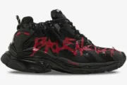 Side view of Balenciaga Runner Graffiti sneakers in black with red distressed details. - SKU 677403W3RBQ1060