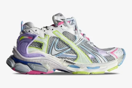 Side profile of Balenciaga Runner Sneaker in distressed multi-color with mesh and layered overlays. - SKU 772767W3RMU1745