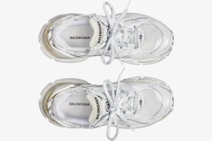 Top-down view of white Balenciaga Runner sneakers featuring mesh panels and chunky soles. - SKU 772774W3RMU9000