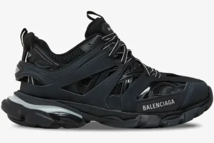 Side profile of a black Balenciaga Track Led sneaker with a chunky multi-layered design and light-up sole. - SKU 555036W2GB11000