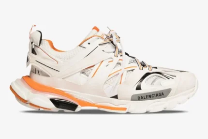 Balenciaga Track sneakers in white and orange, side profile view on a plain white background. - SKU 542023W1GB19059
