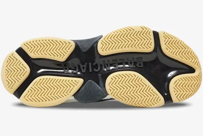 Bottom view of the Balenciaga Triple S sneaker sole in black and beige with embossed logo. - SKU 533882W09OM1000