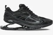 Side view of Balenciaga X-Pander Distressed Suspended Heel Sneaker in black with a mechanical heel. - SKU 653871W2RA21000