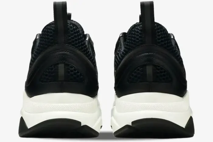 Rear view of Dior B22 sneakers in black calfskin and mesh with a chunky white midsole. - SKU 3SN231YKB_H969
