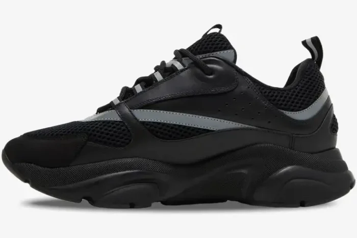 Profile view of Dior B22 sneakers in black and silver reflective mesh and leather with a chunky sole. - SKU 3SN231ZNG_H969