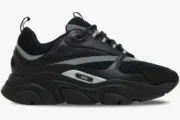 Side view of Dior B22 'Black Silver Reflective' luxury sneakers with black mesh, leather panels, and a chunky sole. - SKU 3SN231ZNG_H969