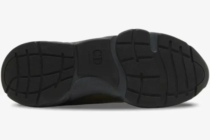 Bottom view of the black rubber outsole of a Dior B22 Khaki Black Calfskin chunky sneaker. - SKU 3SN231ZHM_H630