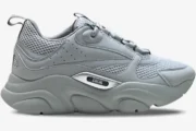 Side profile of a Dior B22 'Triple Grey' luxury sneaker featuring mesh and leather panels. - SKU 3SN231YKA804