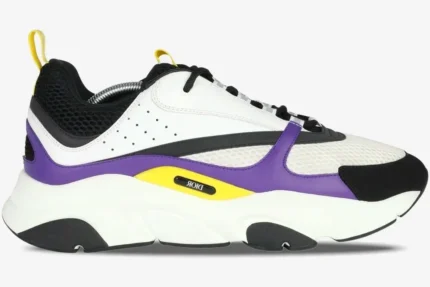 Side profile of a Dior B22 sneaker in violet, white, and black with yellow accents on a chunky sole. - SKU 3SN231YKA_H065