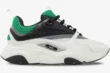 Side profile of a Dior B22 sneaker in white, black, and green with a chunky sole. - SKU 3SN231YKA_H066