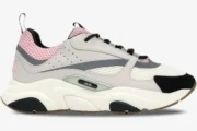 Dior B22 sneaker in white, grey, pale pink, and black, shown from a side profile view. - SKU 3SN231YKB_H069