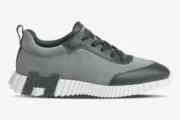 Side profile of Hermès Bouncing Sneaker in grey suede and leather with a white chunky sole. - SKU H231763ZH6I400