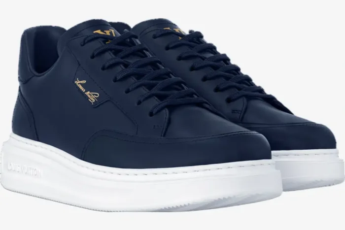 Louis Vuitton Beverly Hills Marine sneakers in navy blue leather with white soles, front three-quarter view. - SKU 1ADFXW