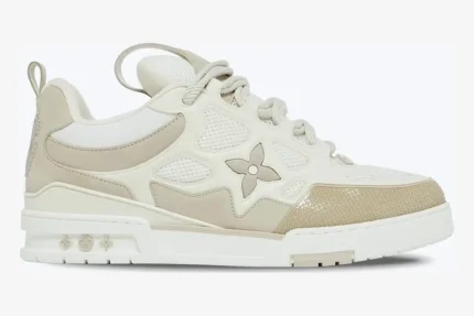 Louis Vuitton LV Skate Sneaker in beige and white, side profile view showing monogram flower detail. - SKU 1AARQS