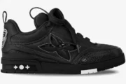 Side profile of a black Louis Vuitton LV Skate Sneaker with a large flower logo and thick laces. - SKU 1AB8I2-1ABZ5D