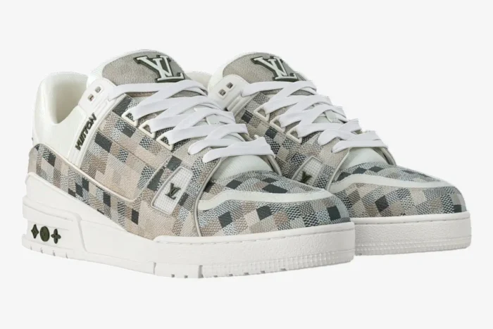 Louis Vuitton LV Trainer in beige Damoflage camouflage pattern, three-quarter front view of both sneakers. - SKU 1AF6A6