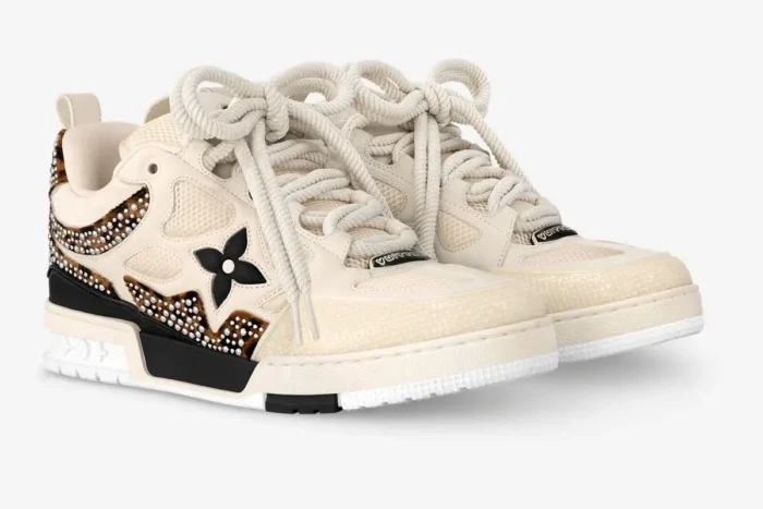 Louis Vuitton LV Trainer LV149 sneakers in beige, black, and brown leopard print, three-quarter view.