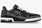 Side profile of a Louis Vuitton LV Trainer in black and white plaid Damier 3D pattern with white laces. - SKU 1A9ZAY