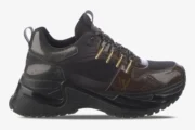 Side view of a Louis Vuitton Run Away Pulse sneaker featuring black mesh and brown monogram canvas. - SKU 1A40Z8