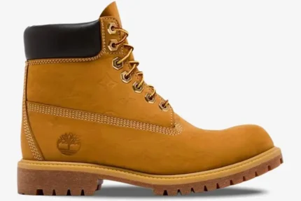 Side profile of a Louis Vuitton x Timberland 6-inch ankle boot in monogram tan nubuck leather. - SKU 1AD72X