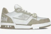 Side profile of a Louis Vuitton Trainer Sneaker in beige monogram denim with a velcro strap and mesh panels. - SKU 1A9ZC2