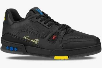 Side view of a black Louis Vuitton Trainer Signature Edition sneaker with colorful accents and gold script. - SKU 1A8ZQJ