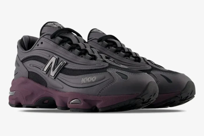 New Balance 1000 sneakers in Magnet Titular Grey and Deep Plum, shown from a three-quarter front angle. - SKU M1000EB