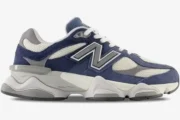 Side profile of New Balance 9060 Natural Indigo sneakers featuring navy suede and grey mesh overlays. - SKU U9060IND