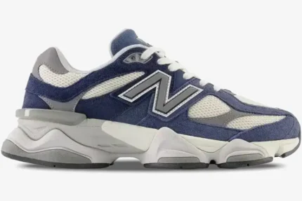 Side profile of New Balance 9060 Natural Indigo sneakers featuring navy suede and grey mesh overlays. - SKU U9060IND