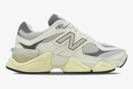 New Balance 9060 sneakers in white, grey, and beige, shown from a side profile view. - SKU U9060AGAD
