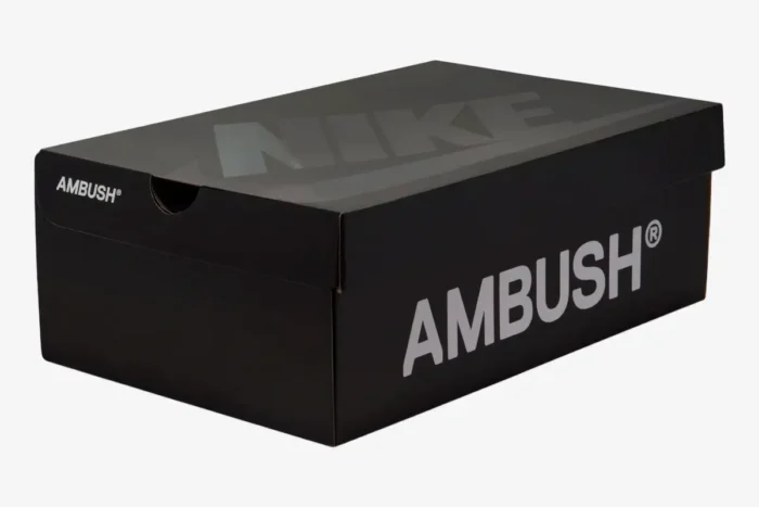 Black Nike x Ambush shoebox with white and glossy black branding, three-quarter view. - SKU DV3464-400