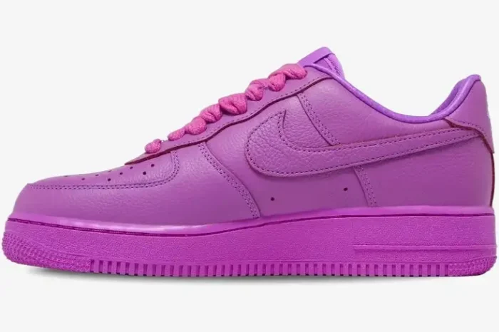 Side profile of a purple Nike Air Force 1 Low x CPFM sneaker featuring thick rope laces and tumbled leather. - SKU FQ7069-500
