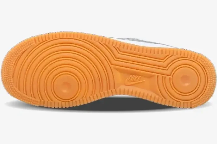 Bottom view of Nike Air Force 1 Low x Travis Scott 'Sail' showing the gum rubber outsole and traction pattern. - SKU AQ4211-101