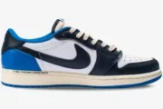Nike Air Jordan 1 Low OG x Travis Scott x Fragment sneaker in white, black, and blue, medial profile view. - SKU DM7866-140