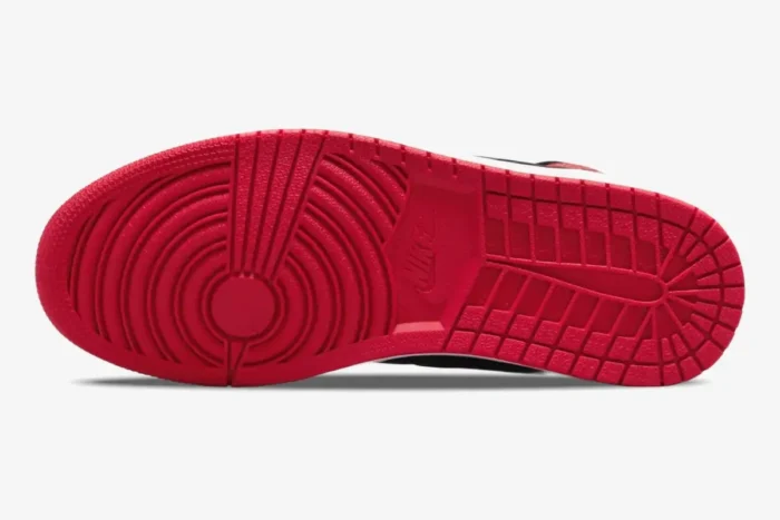 Bottom view of the red rubber outsole on the Air Jordan 1 High OG Patent Bred sneaker. - SKU 555088-063