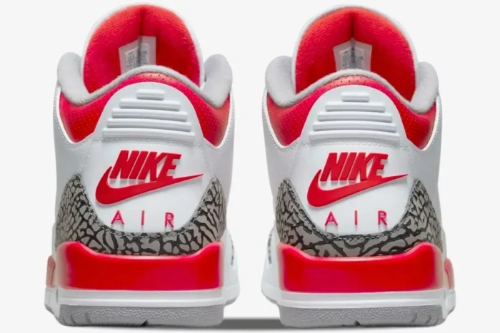 Rear view of Air Jordan 3 Retro Fire Red OG sneakers with white leather, red accents, and elephant print. - SKU DN3707-160