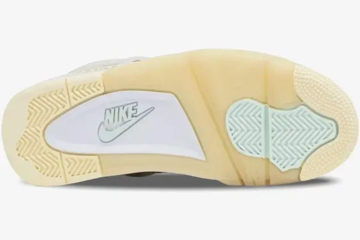Bottom view of the Air Jordan 4 Retro x Off-White Sail women's sneaker outsole with cream and light blue traction pads. - SKU CV9388-100