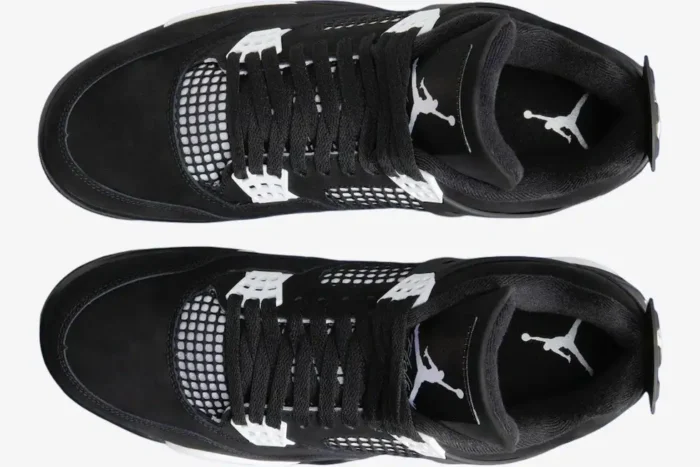 Top-down view of black Air Jordan 4 Retro sneakers with white accents and Jumpman logos. - SKU FQ8138-001