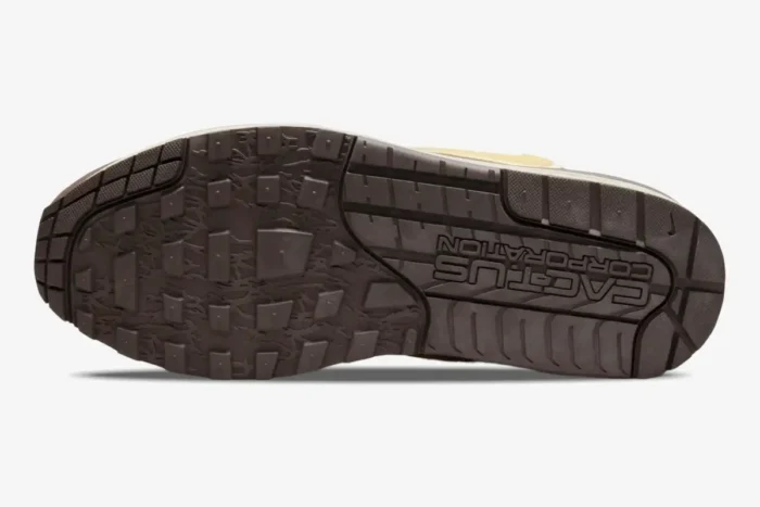 Bottom outsole view of Nike Air Max 1 x Cactus Jack Baroque Brown showing Cactus Corporation branding. - SKU DO9392-200