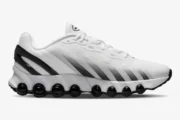 White and black Nike Air Max DN8 sneaker shown from a side profile view with black air units. - SKU  FQ7860-100